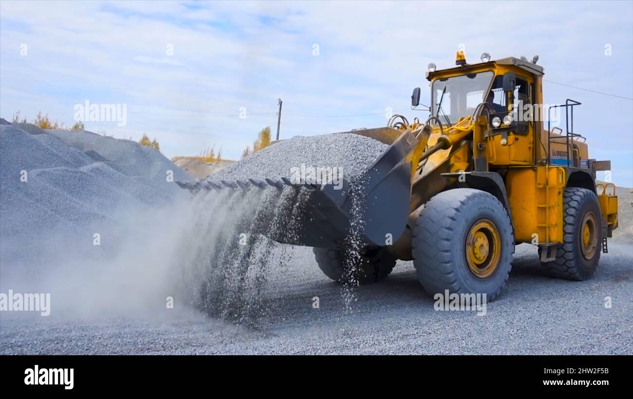 Tractor on construction site carries rubble. Stock footage. Tractor ...