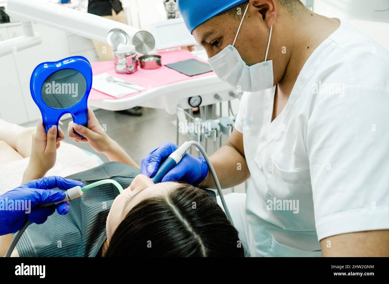 Dentist performs a regular examination of the patient Stock Photo Alamy