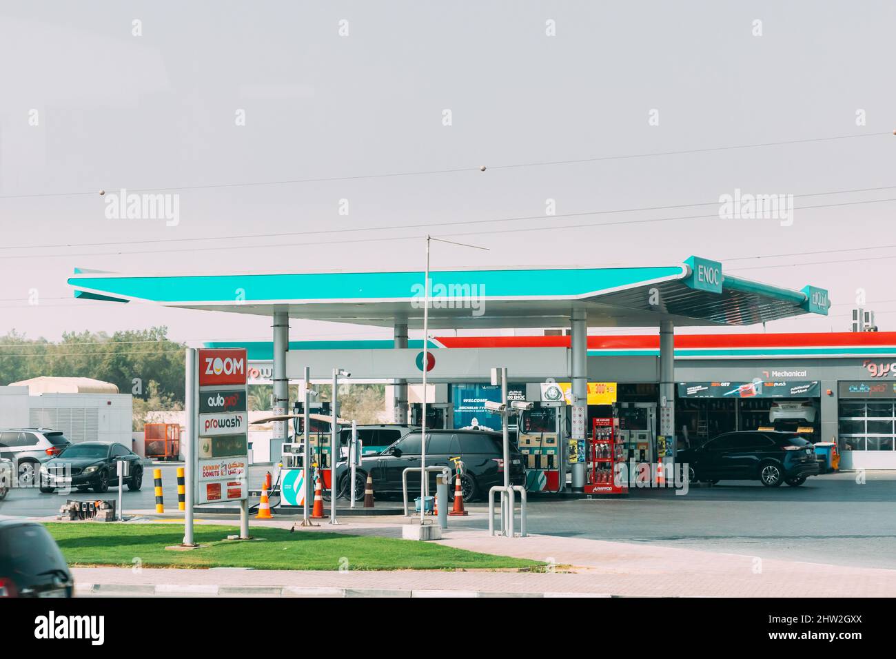 Dubai, UAE, United Arab Emirates - May 28, 2021: Car refuel at ENOC oil station in sunny summer day. ENOC, Emirates National Oil Company is global Stock Photo