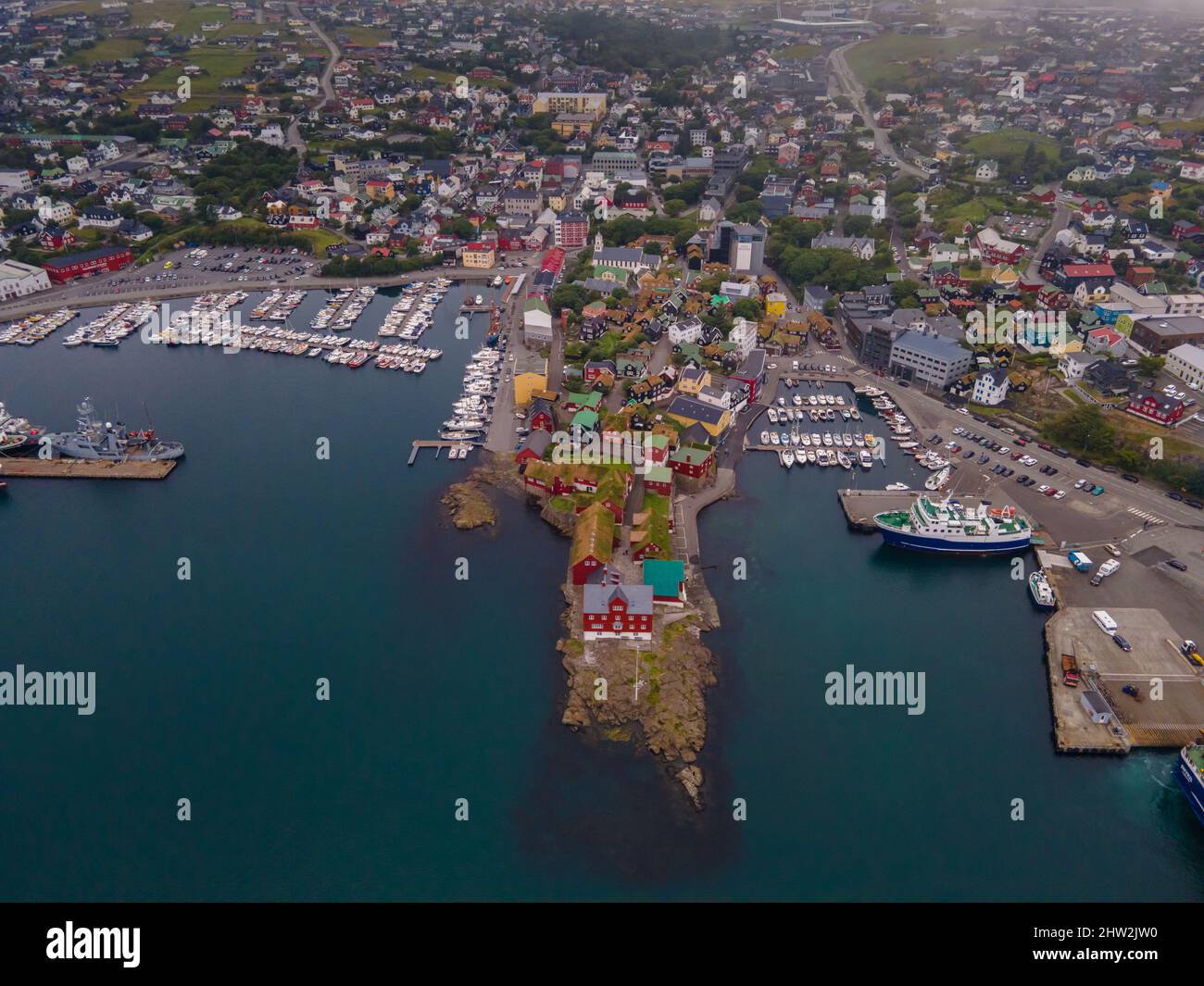 Beautiful aerial view of the city of Torshavn in the Faroe Islands and its classic colorful houses, red Government building with grass on the roof, and Stock Photo