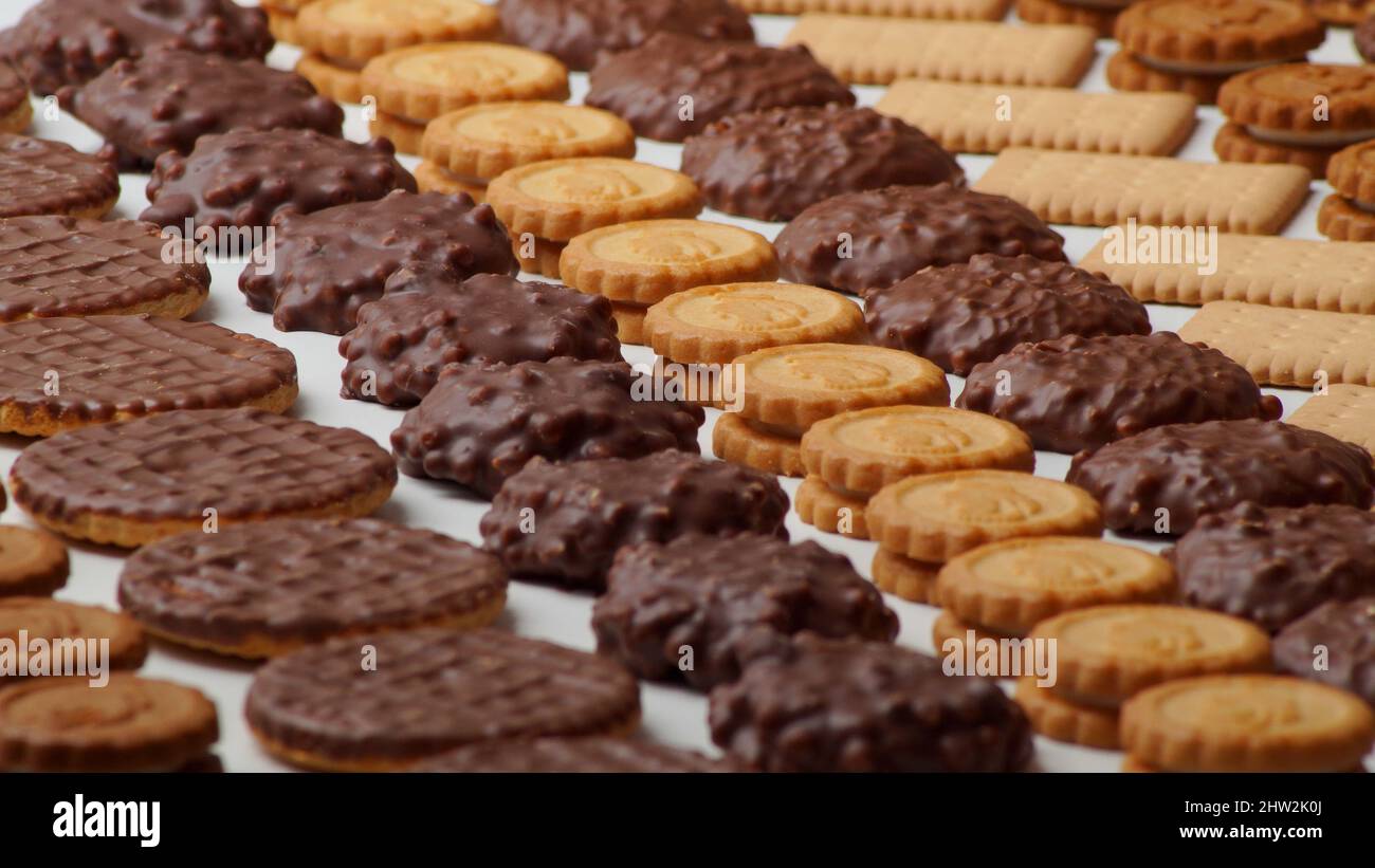 Closeup photo of beautiful chocolate glazed cookies, round filled and