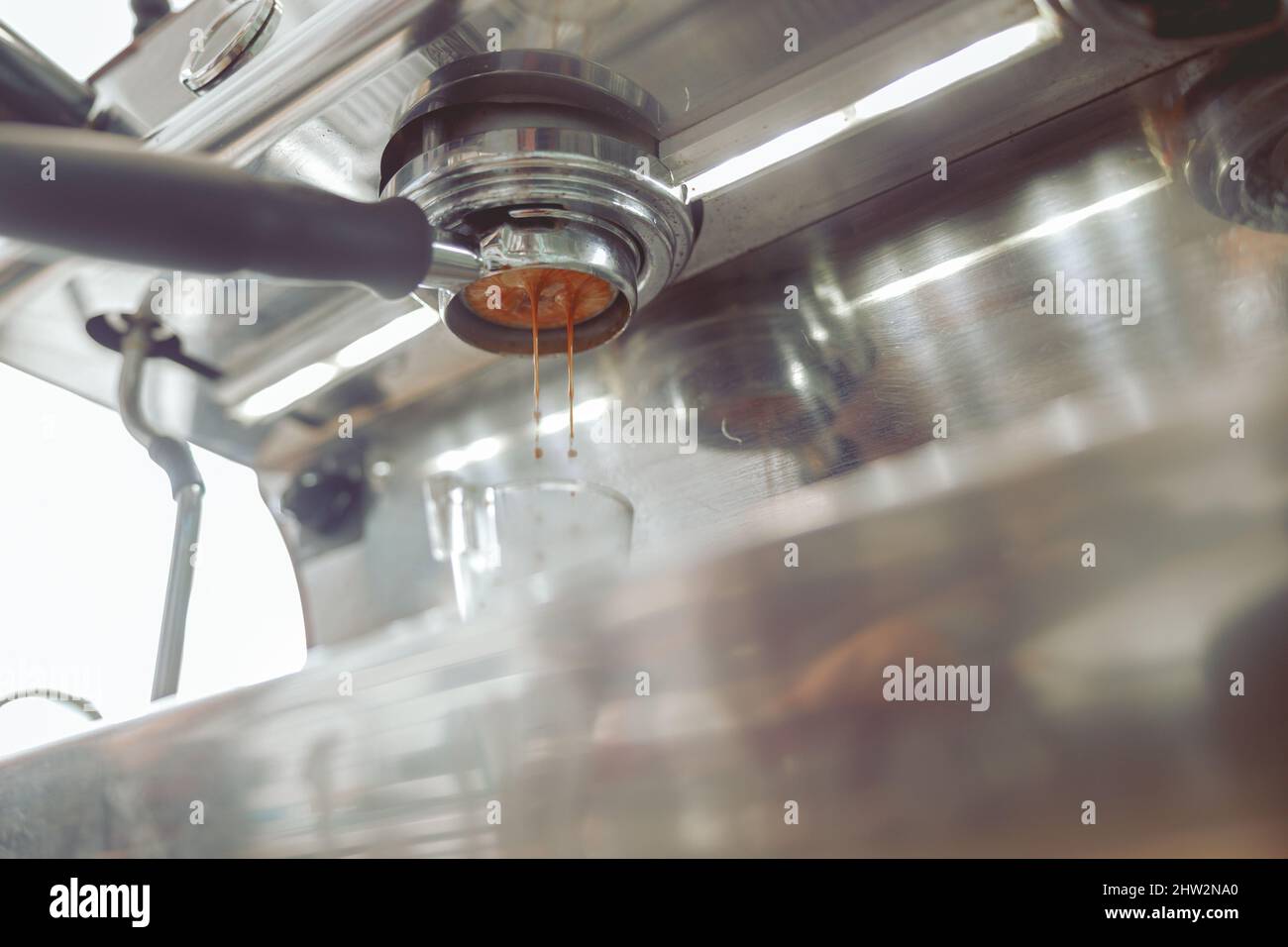 Photo of the process of making coffee in coffee machine Stock Photo - Alamy