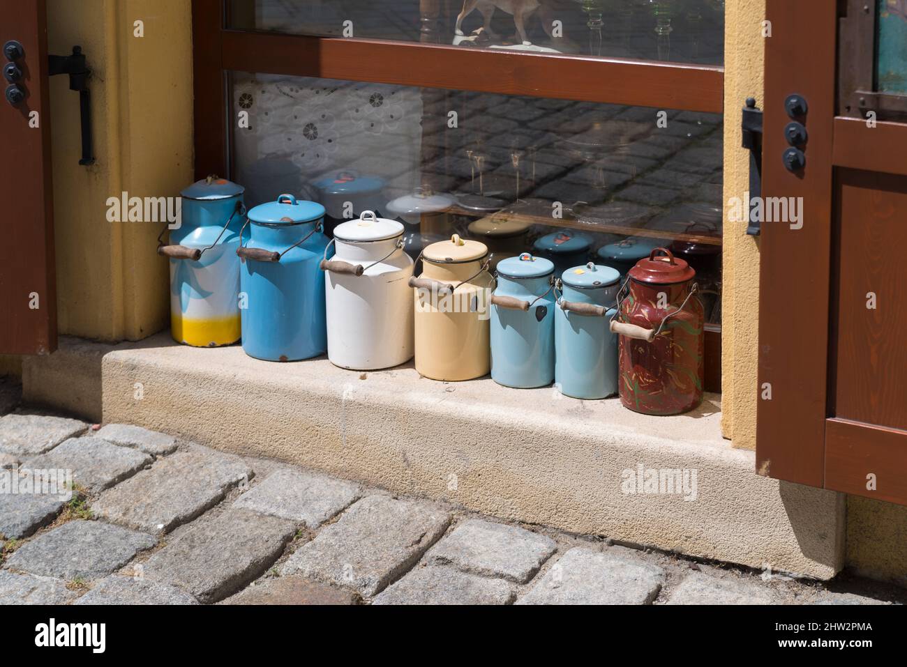 metal cans in several colors for sale in front of a store in bratislava, slovakia Stock Photo