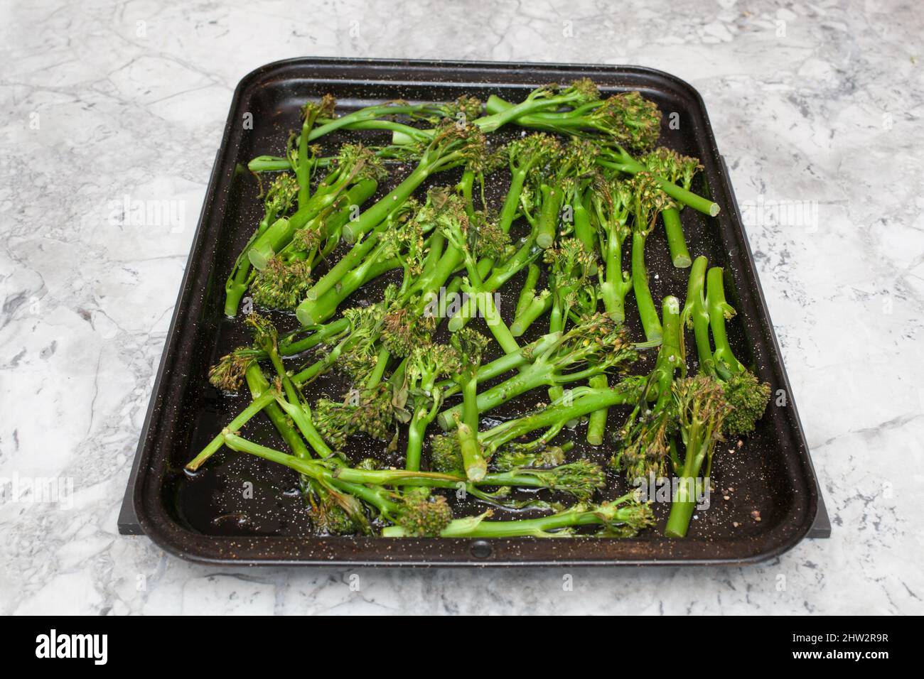 Roasted broccoli on a baking tray Stock Photo