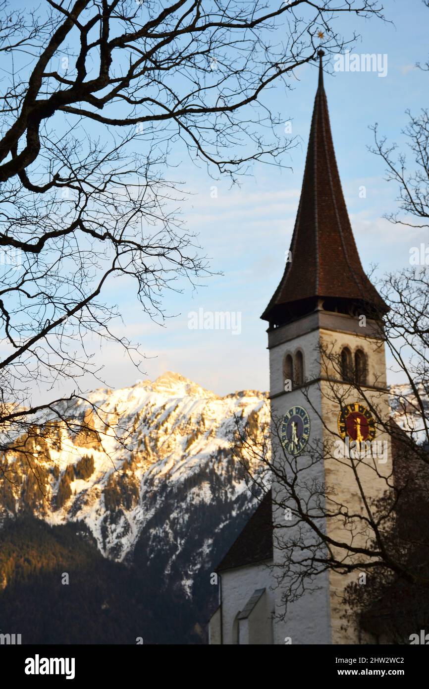 Clock tower of the Interlaken Castle Church in Switzerland Stock Photo