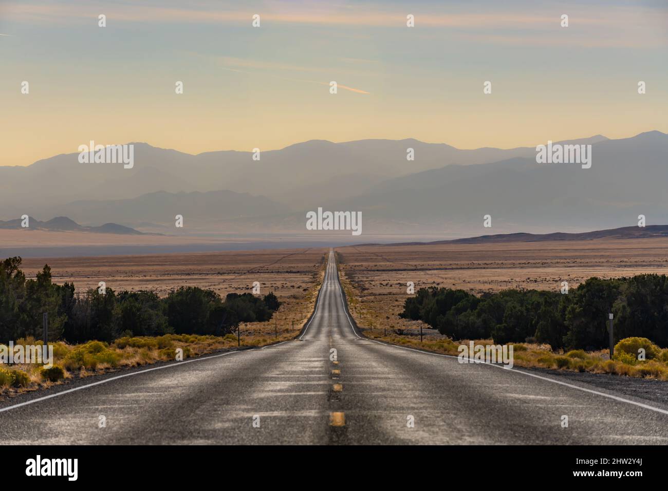 US Highway 50 stretches into the distance in western Utah. No cars to be seen for miles. Stock Photo