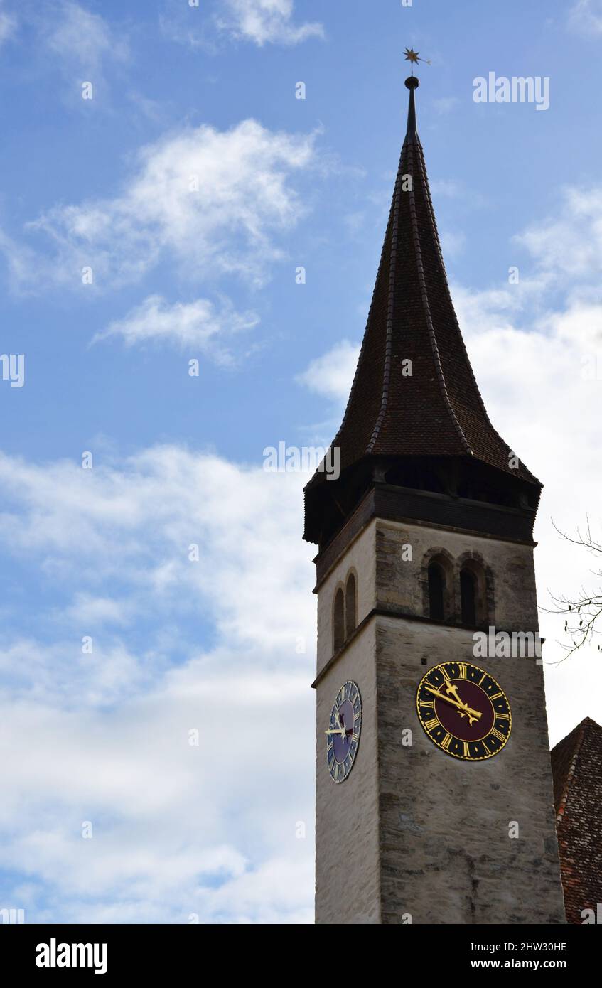Clock tower of the Interlaken Castle Church in Switzerland Stock Photo