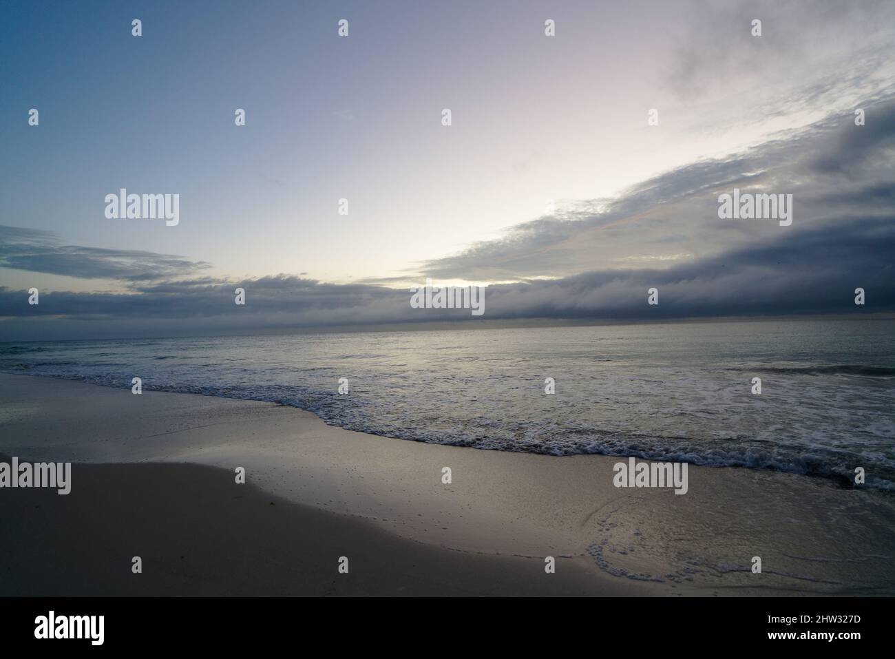 Scenic view on beach during sunrise Stock Photo