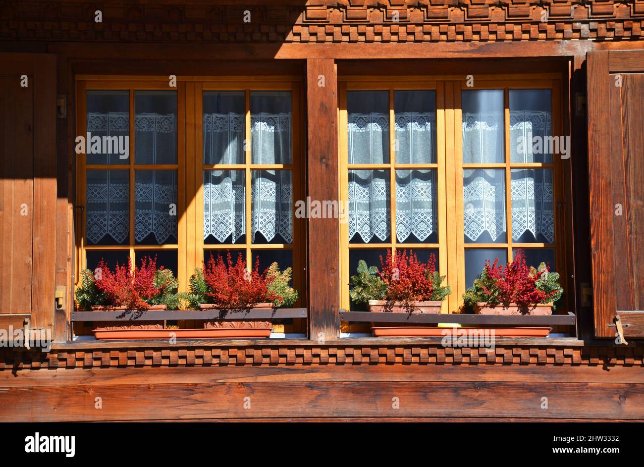 Old style open windows of a house in a swiss village Stock Photo