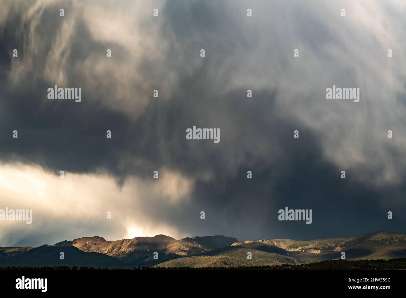 A thunderstorm forms over in the mountains in Colorado Stock Photo