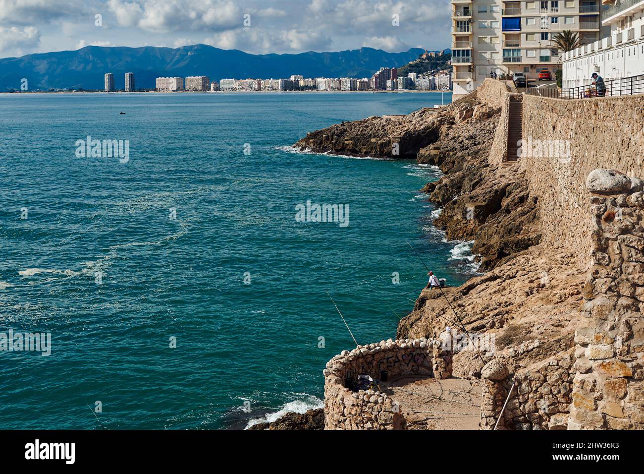 Punta del Pensamiento, cliff on the shore of the Mediterranean sea coast of the city of Cullera, place for fishing for anglers, Valencia, Spain. Stock Photo