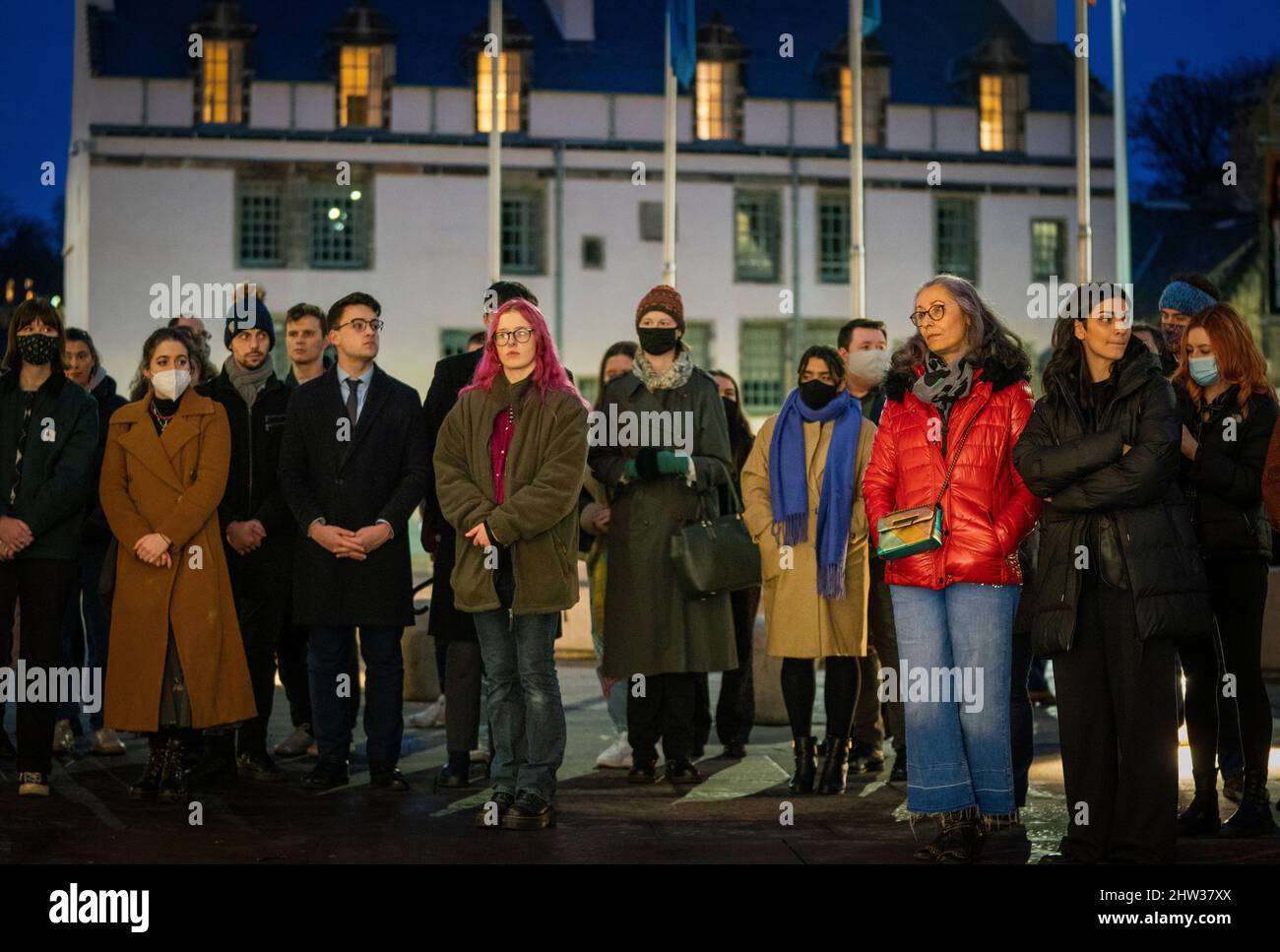 People take part in a memorial protest outside the Scottish Parliament in Edinburgh to mark the anniversary of the murder of Sarah Everard and other women killed by men. Picture date: Thursday March 3, 2022. Stock Photo