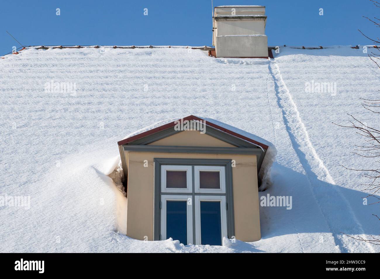 snow-covered house roof Stock Photo