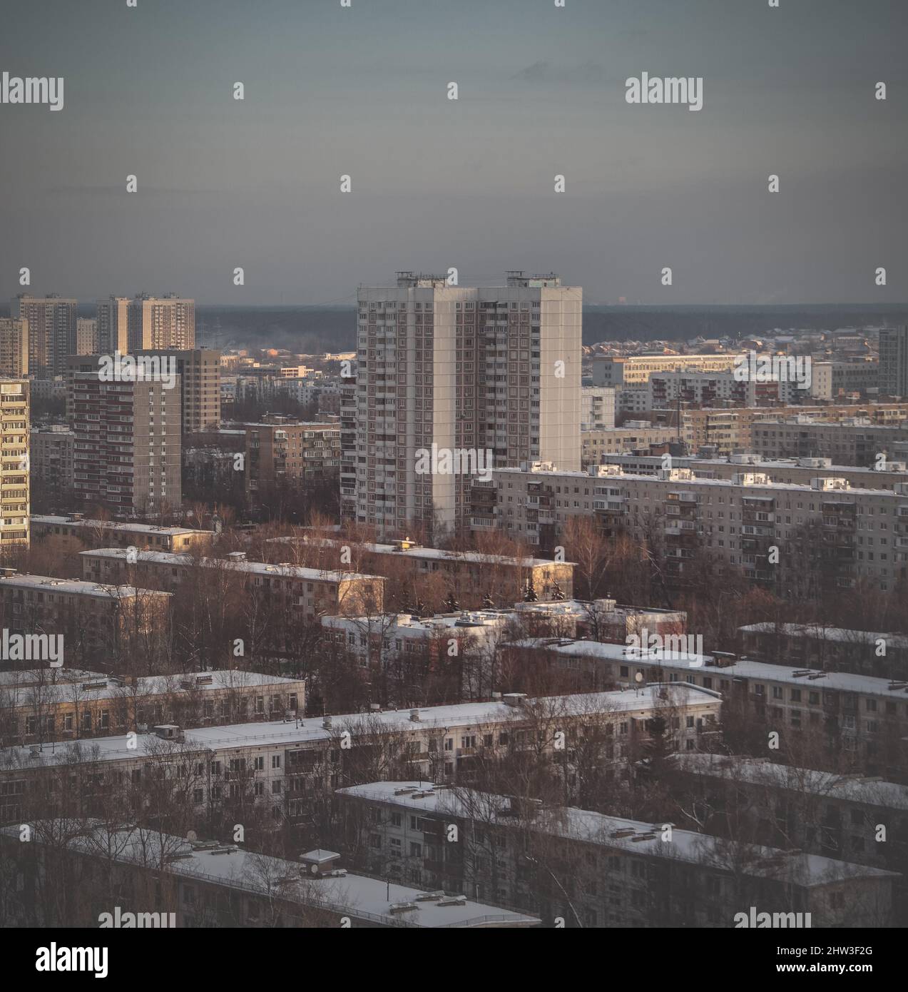 Rooftops and high residential buildings covered by snow. Winter snowy weather in the city. Heating season. Top view of Moscow on a winter day Stock Photo