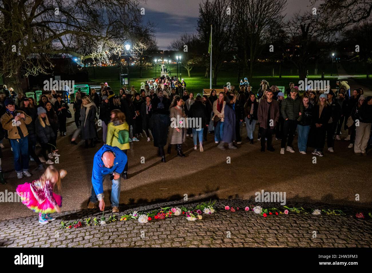 London, UK. 3rd Mar, 2022. Flowers are laid and a few words said - People gather at the Bandstand on Clapham Common on the first anniversary of the murder of Sarah Everard - organised by Urban Angels. She disappeared on March 3 2021 on her way home from Clapham to Brixton. Credit: Guy Bell/Alamy Live News Stock Photo