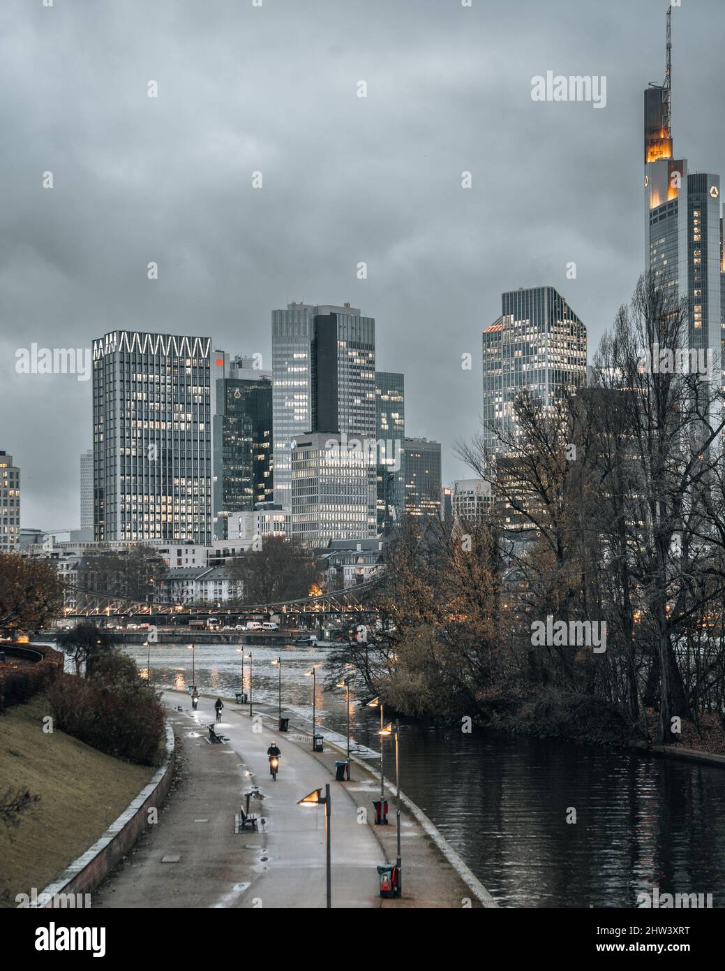 Urban scenery with river and road leading to the city Stock Photo - Alamy