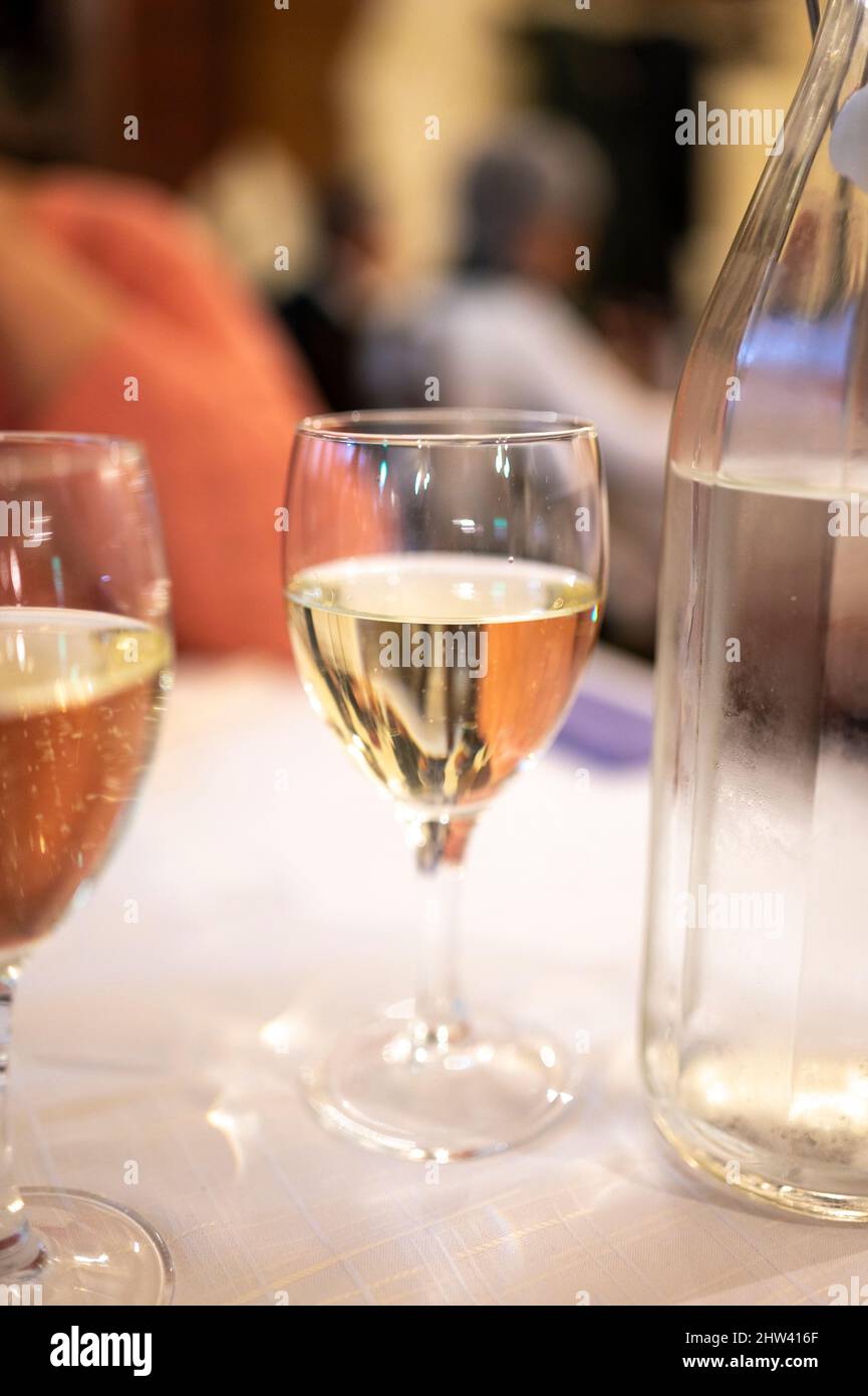 Italian white house wine served in pitcher with two glasses for dinner ...