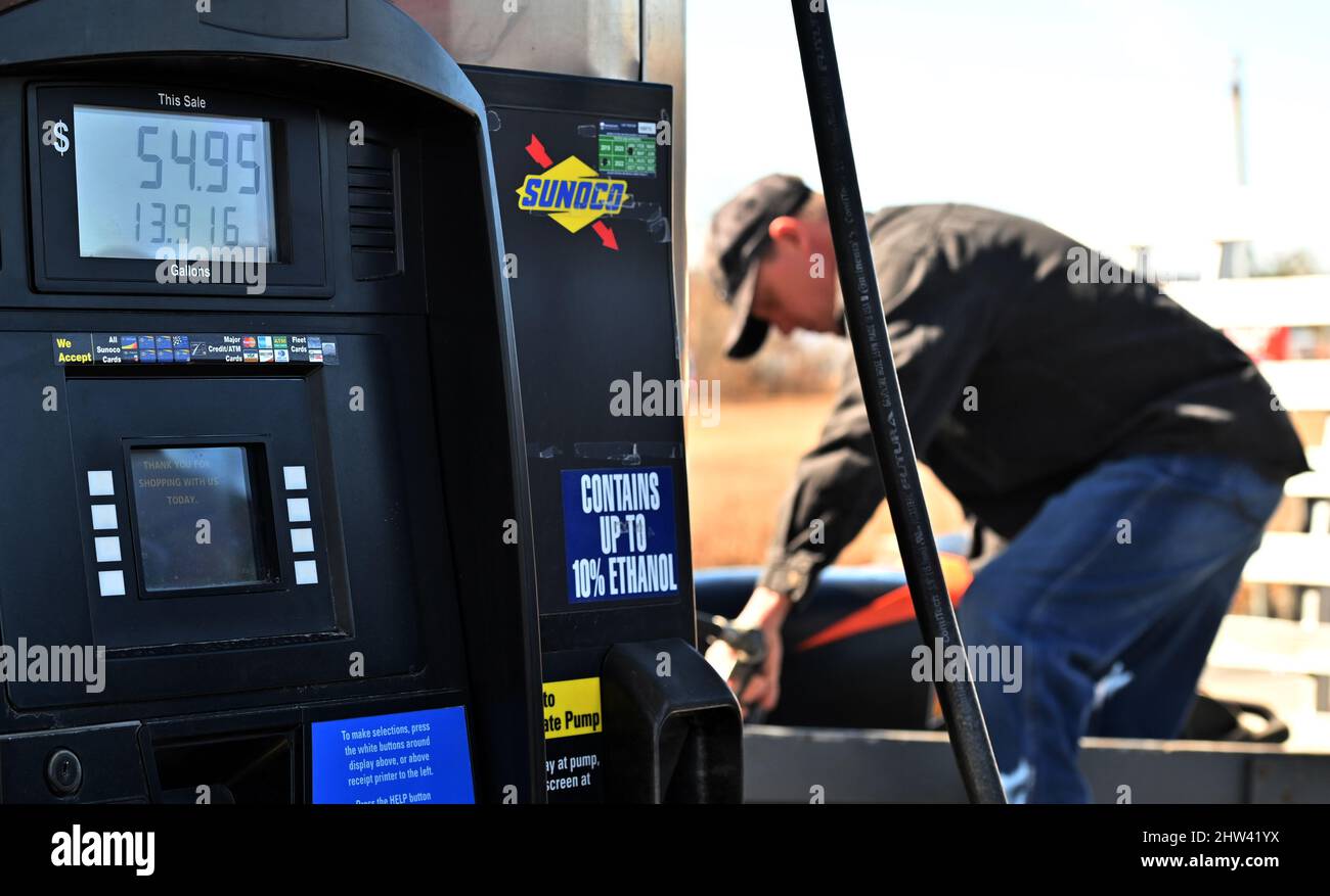 Wilkes Barre, United States. 03rd Mar, 2022. A Sunoco gas pump reading shows more than $54 as a man pumps gas.Gas prices rose 30 cents a gallon at most locations, some broke the $4 mark. Gas prices are spiking due to the Ukraine-Russia crisis. (Photo by Aimee Dilger/SOPA Images/Sipa USA) Credit: Sipa USA/Alamy Live News Stock Photo