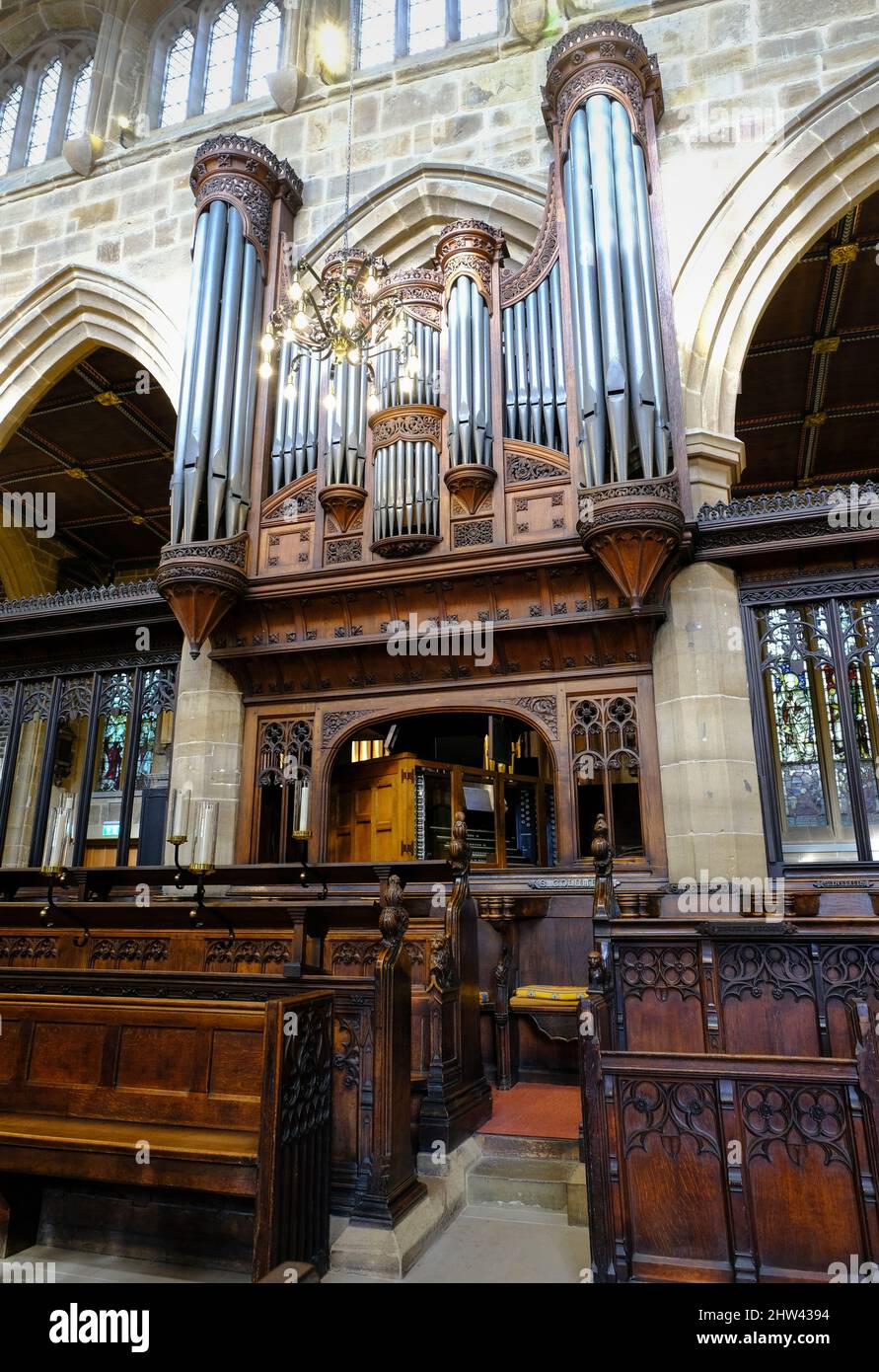 The interior of Wakefield cathedral showing elegant carved woodwork with the organ in the background. Stock Photo