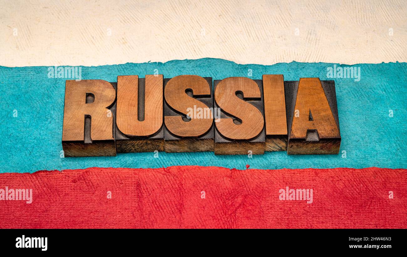 Russia word abstract in vintage letterpress wood type against paper abstract in colors of RUssian national flag Stock Photo