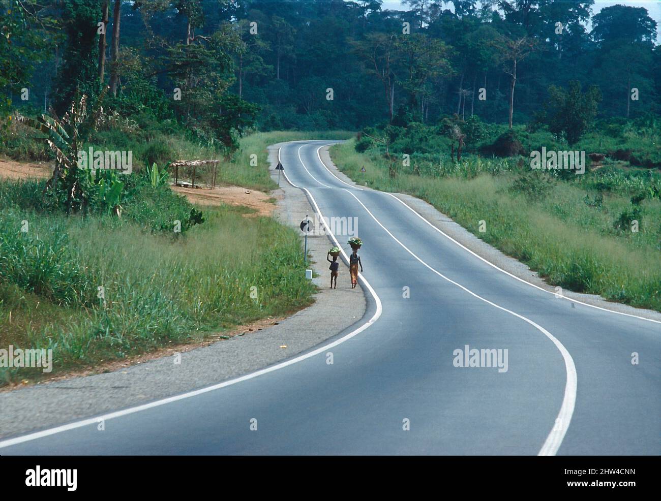 Curvy country road in Ghana, West-Africa. Stock Photo