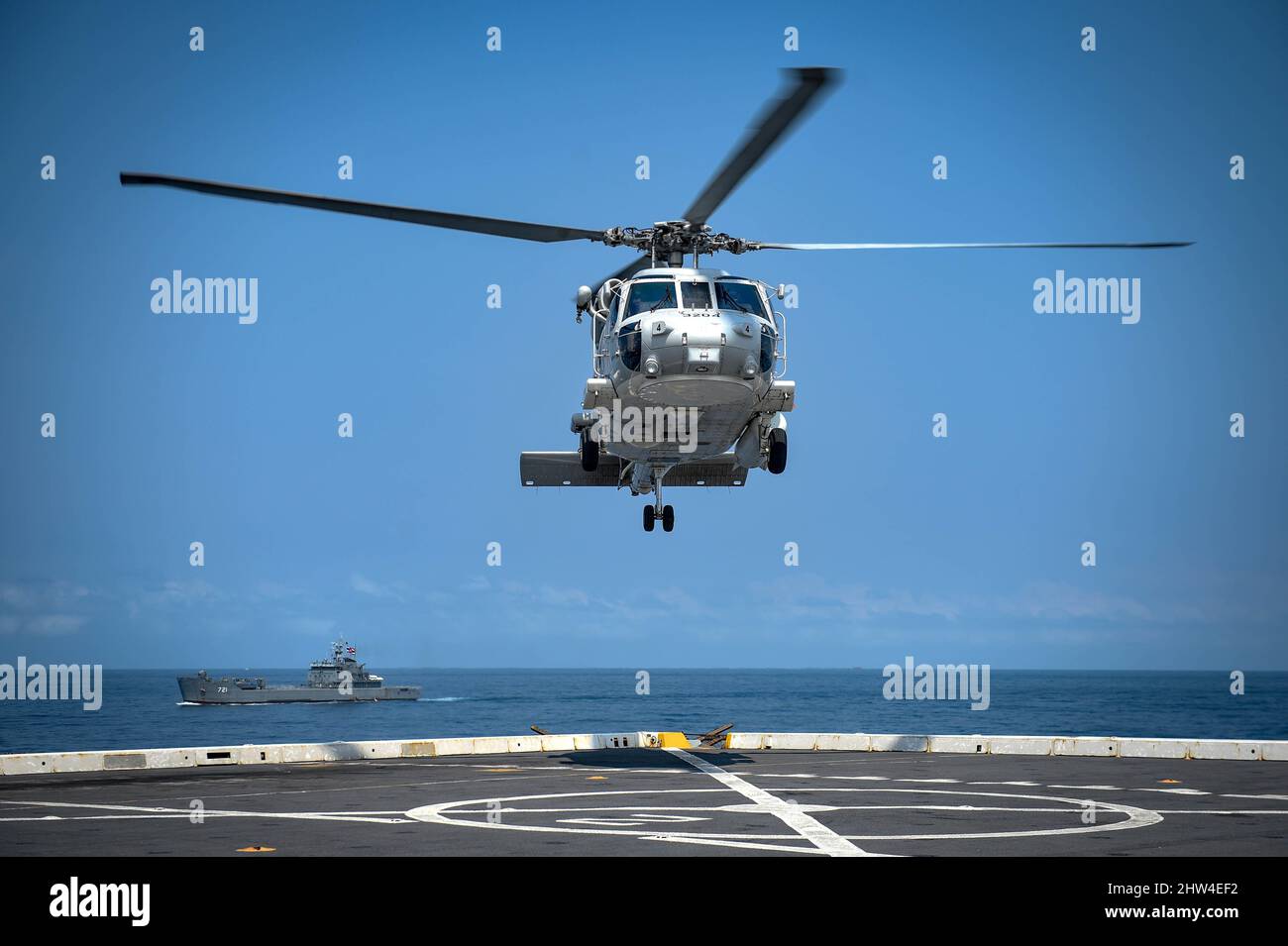 GULF OF THAILAND (March 1, 2022) An SH-70B Sea Hawk helicopter from the Royal Thai Navy lands on the deck of the amphibious transport dock ship USS Green Bay (LPD 20) during exercise Cobra Gold 22. Cobra Gold 2022 is the 14st iteration of the international training exercise that supports readiness and emphasizes coordination on civic action, humanitarian assistance, and disaster relief. From Feb. 22 through March 4, 2022, this annual event taking place at various locations throughout the Kingdom of Thailand increases the capability, capacity, and interoperability of partnered nations while sim Stock Photo