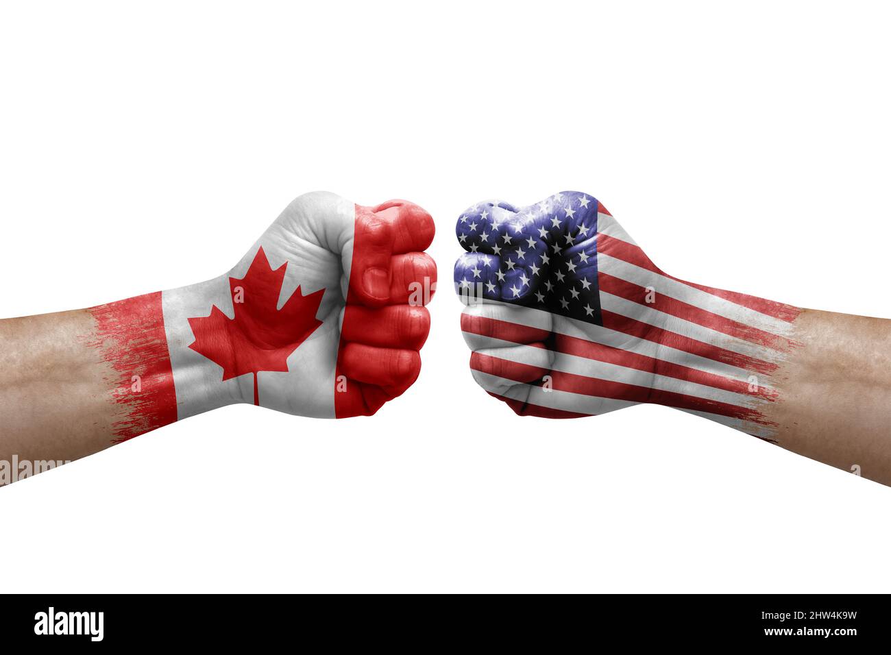Two hands punch to each others on white background. Country flags painted fists, conflict crisis concept between canada and usa Stock Photo