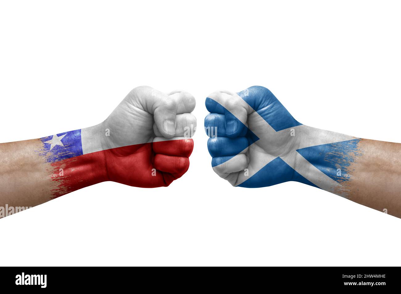 Two hands punch to each others on white background. Country flags painted fists, conflict crisis concept between chile and scotland Stock Photo