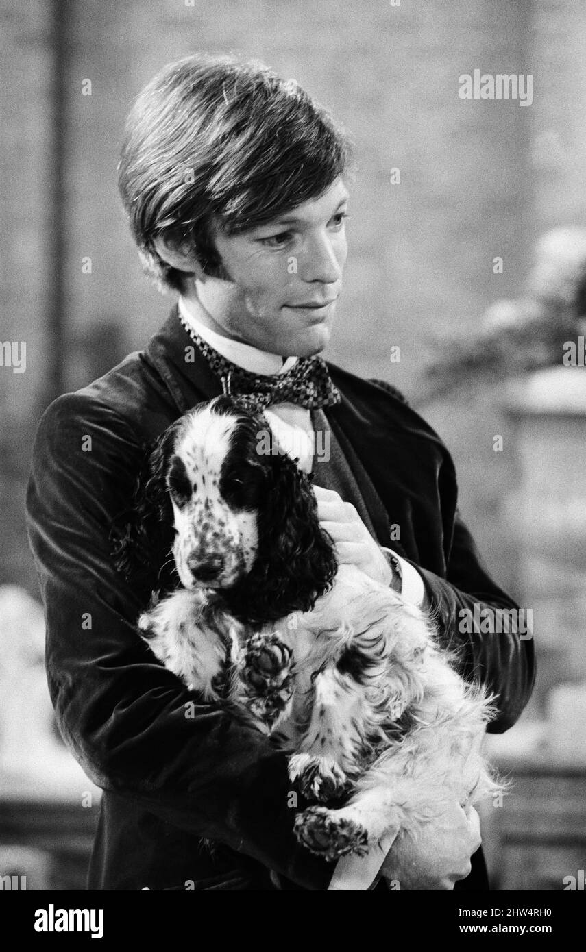 Richard Chamberlain is to star in a BBC 2 colour production of the Henry James play 'The Portrait of a Lady'. His leading lady will be Suzanne Neve. Richard, who plays Ralph, is seen rehearsing in Edwardian costume at the BBC studios, holding 'Lark' a spaniel featured in the play. 8th December 1967. Stock Photo