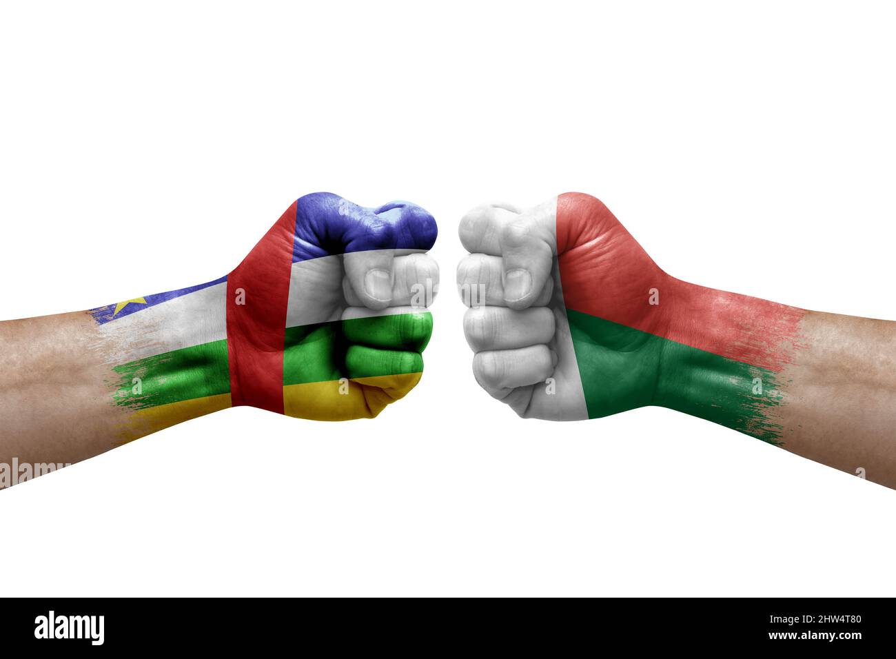 Two hands punch to each others on white background. Country flags painted fists, conflict crisis concept between central african republic and madagasc Stock Photo