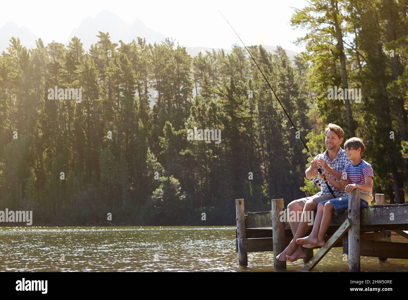 Bonding doesnt get better than this. Shot of a father and son on a fishing trip. Stock Photo
