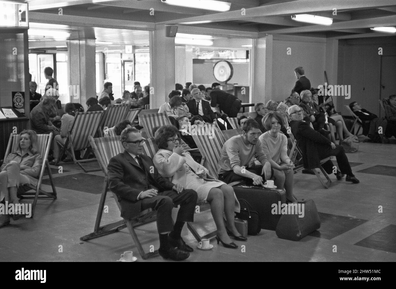 Holidaymakers waiting for their delayed flight to be called at Southend Airport 13th July 1968 Stock Photo