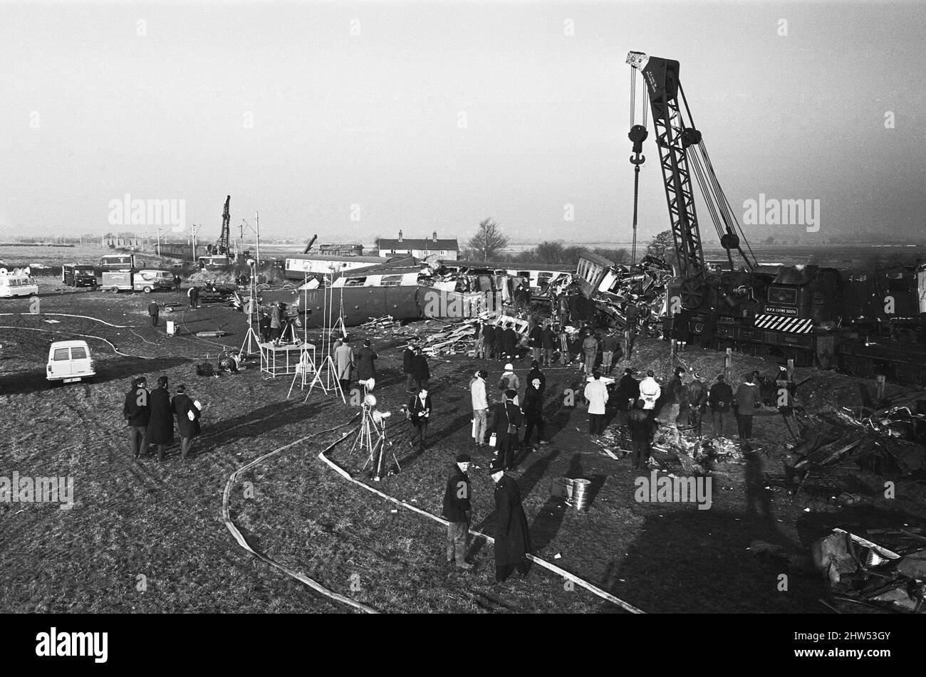 Heavy lifting gear clears the wreckage of the Hixon rail disaster. The accident occurred after a Inter-City train which crashed into a giant transformer on the level crossing at Hixon near Stafford on Saturday (6-1-68). In the crash eleven people were killed and forty injured. 6th January 1968 Stock Photo