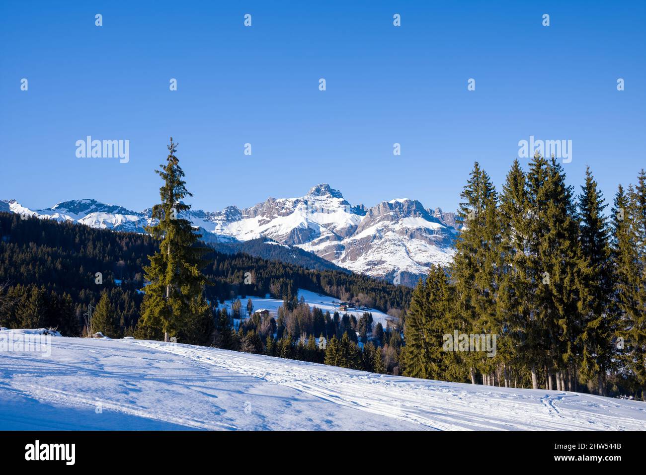 This landscape photo was taken in Europe, in France, Rhone Alpes, in Savoie, in the Alps, in winter. We see La Chaine des Aravis in the snowy mountain Stock Photo