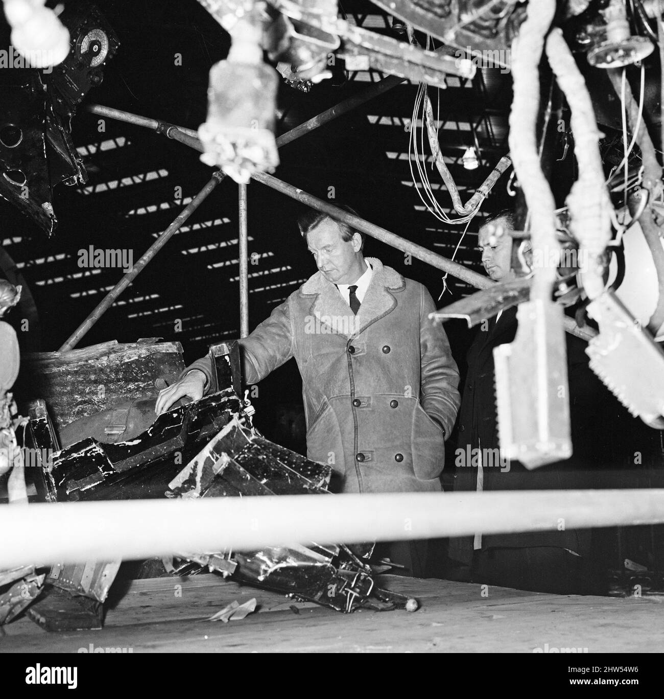 Captain Harry Marlow, inspects the wreckage of his British Midland plane, now at Farnborough Aerodrome.Captain Marlow Survived the Stockport air crash of 4th June 1967  The Stockport air disaster was the crash of a Canadair C-4 Argonaut aircraft owned by British Midland Airways, registration G-ALHG,[1] in a small open area at Hopes Carr near the centre of Stockport, Cheshire, England on Sunday 4 June 1967. 72 of the 84 aboard were killed in the accident. Of the 12 survivors, all were seriously injured. It currently stands as the fourth worst disaster in British aviation history, and the third Stock Photo