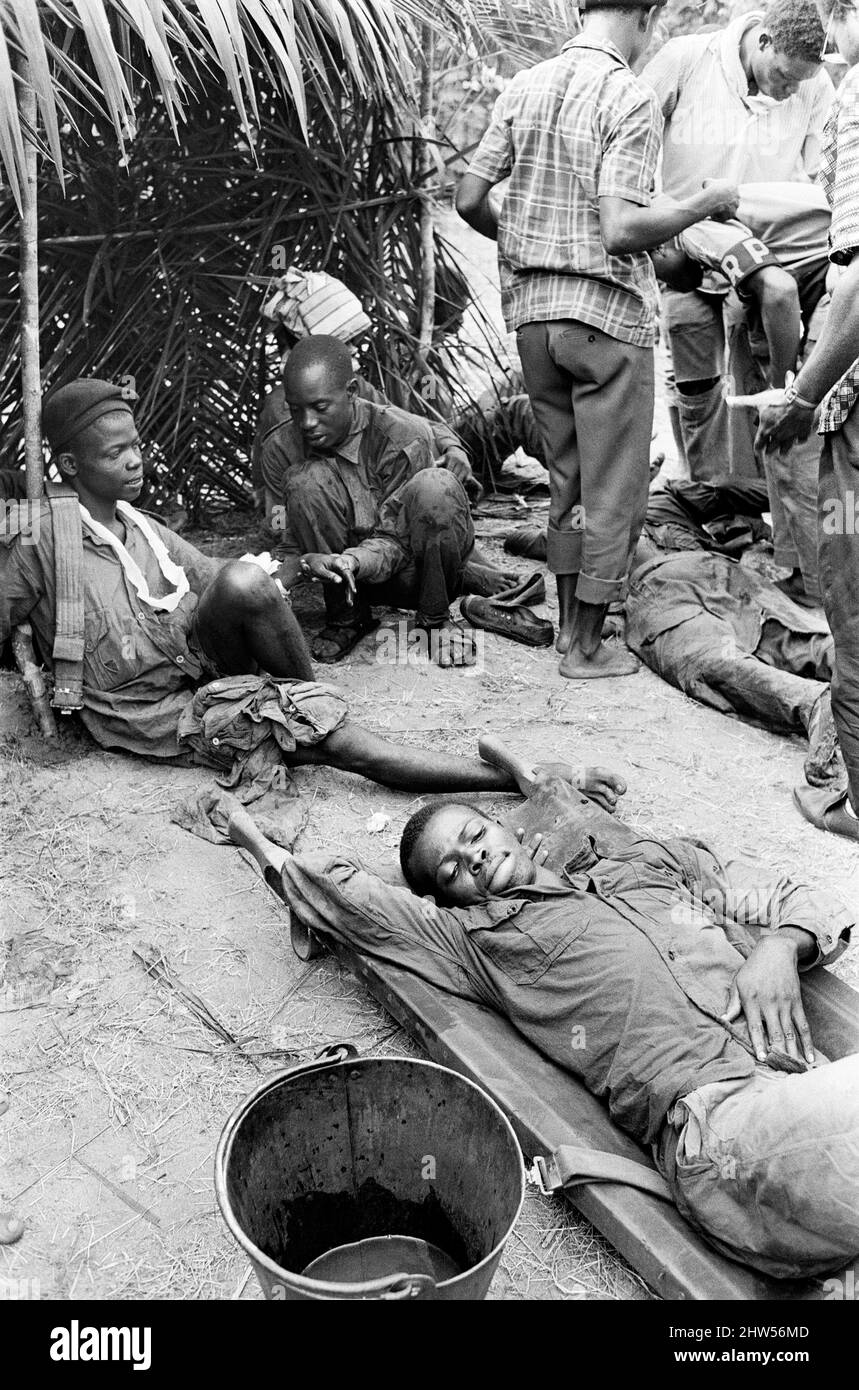 Injured  Biafran soldiers seen here recuperating during the Biafran conflict. 11th June 1968 The Nigerian Civil War, also known as the Biafran War endured for two and a half years, from  6 July 1967 to 15 January 1970, and was fought to counter the secession of Biafra from Nigeria. The indigenous Igbo people of Biafra felt they could no longer co-exist with the Northern-dominated federal government following independence from Great Britain. Political, economic, ethnic, cultural and religious tensions finally boiled over into civil war following the 1966 military coup, then  counter-coup, which Stock Photo