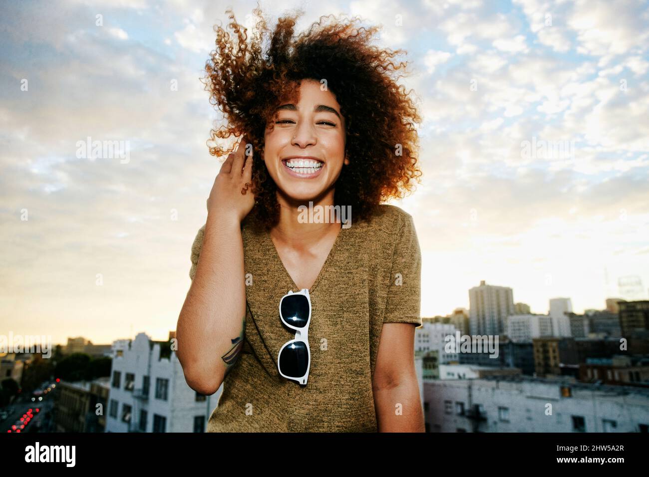 Young hispanic woman shades eyes hi-res stock photography and images ...