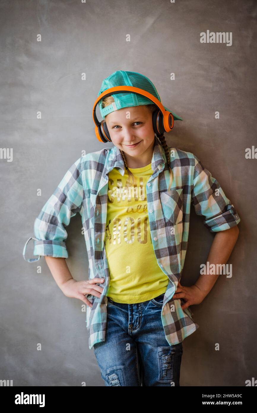 Portrait of smiling girl (10-11) withe headphones Stock Photo