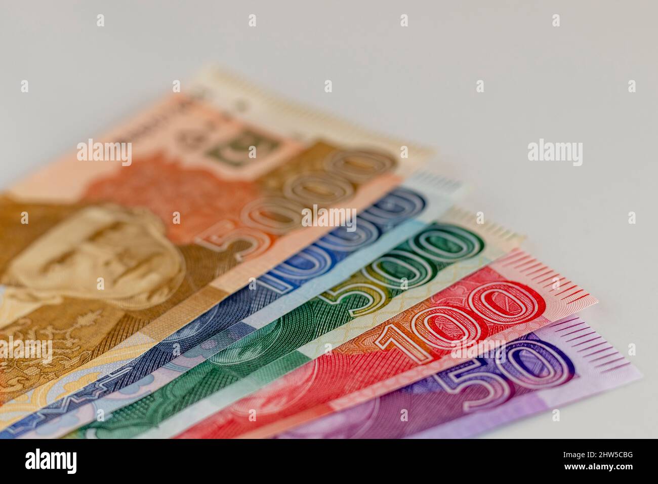 Pakistan currency banknotes on isolated white background with selective focus Stock Photo