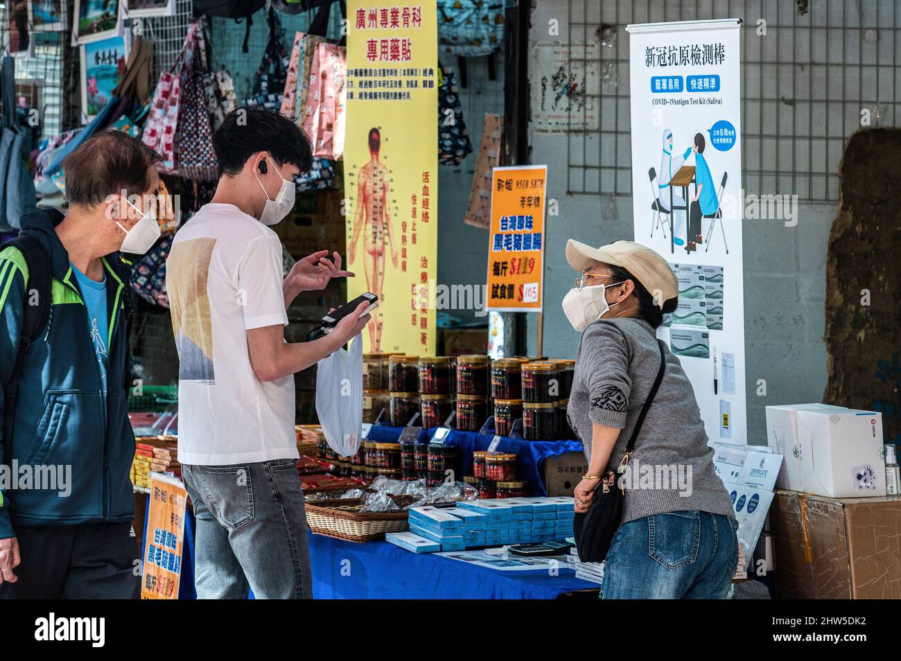 Hong Kong, China. 1st Mar, 2022. A lady sells Rapid Antigen Test kits
