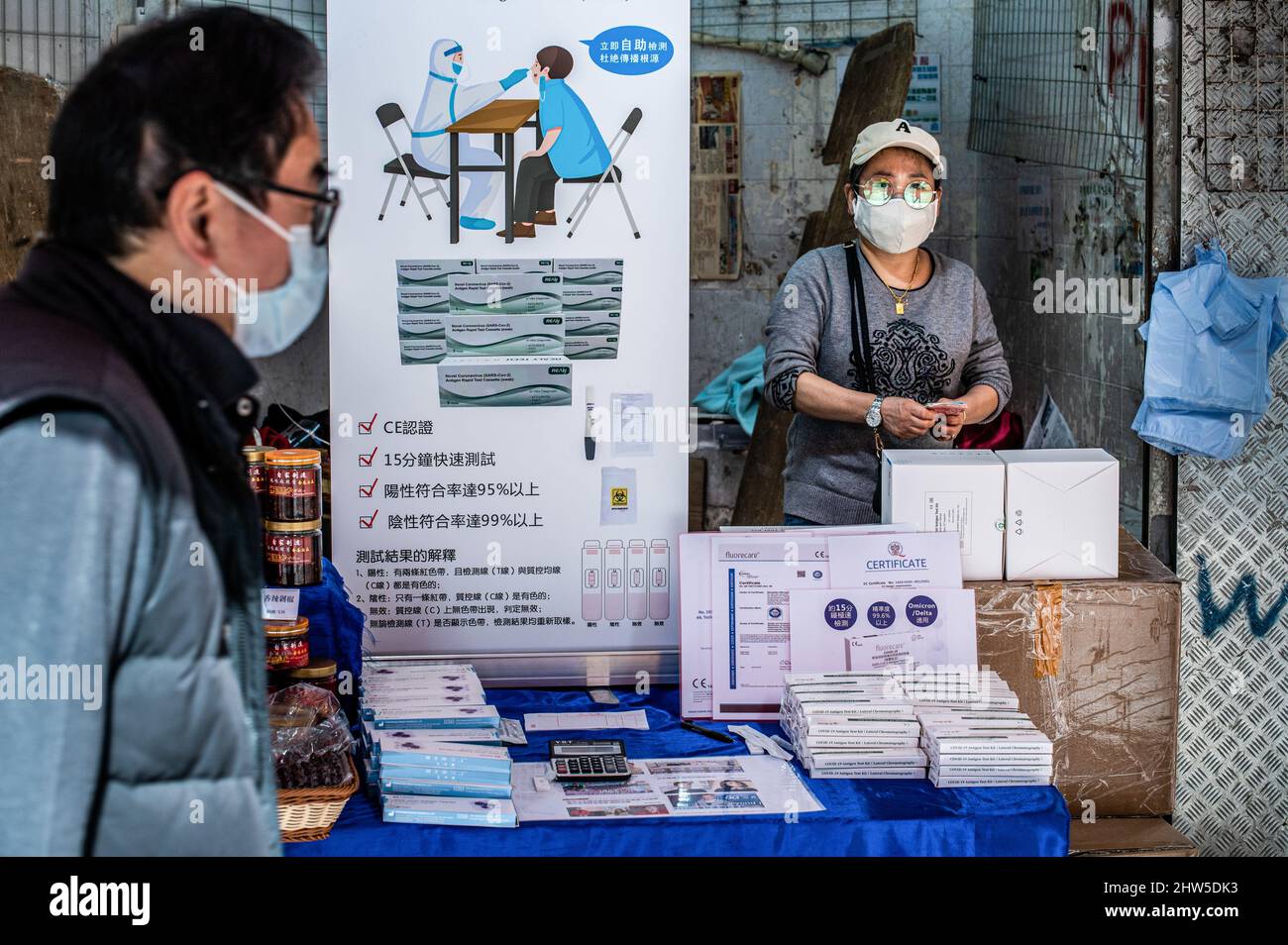 Hong Kong, China. 1st Mar, 2022. A lady sells Rapid Antigen Test kits
