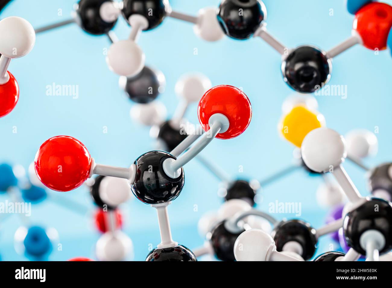 Molecular model against blue background Stock Photo - Alamy