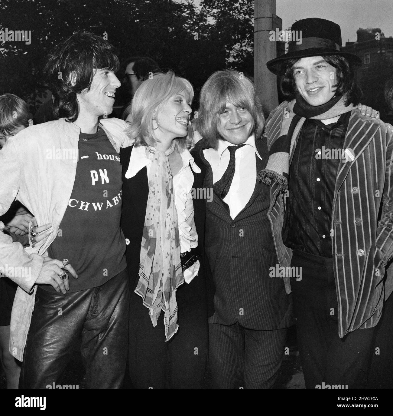 Brian Jones of the Rolling Stones pop group appears at the Inner London Sessions on drugs charges. Here he is pictured with girlfriend Suki Potier and bandmates Keith Richards (left) and Mick Jagger after being found guilty of possessing dangerous drugs and fined £50 plus costs. 26th September 1968. Stock Photo