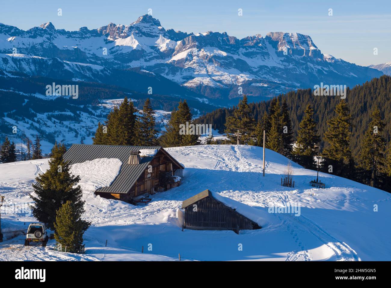 This landscape photo was taken in Europe, in France, Rhone Alpes, in Savoie, in the Alps, in winter. We see La Chaine des Aravis dominate the Savoyard Stock Photo