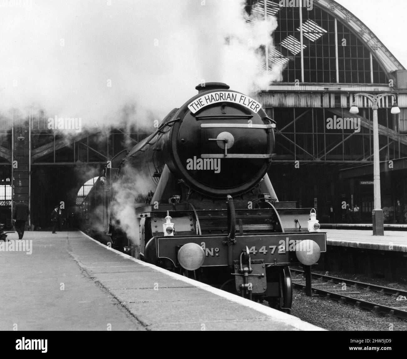 Railway fans celebrate London - Newcastle run with a mile a minute trip on the Flying Scotsman. The A3 Pacific locomotive was brought out of retirement to commemorate the 40th anniversary of the first non - stop train journey between London and Newcastle by pulling a special train called the Hadrian Flyer. Our picture shows 'The Hardrian Flyer' steaming out of Kings Cross station. 17th June 1967 Stock Photo