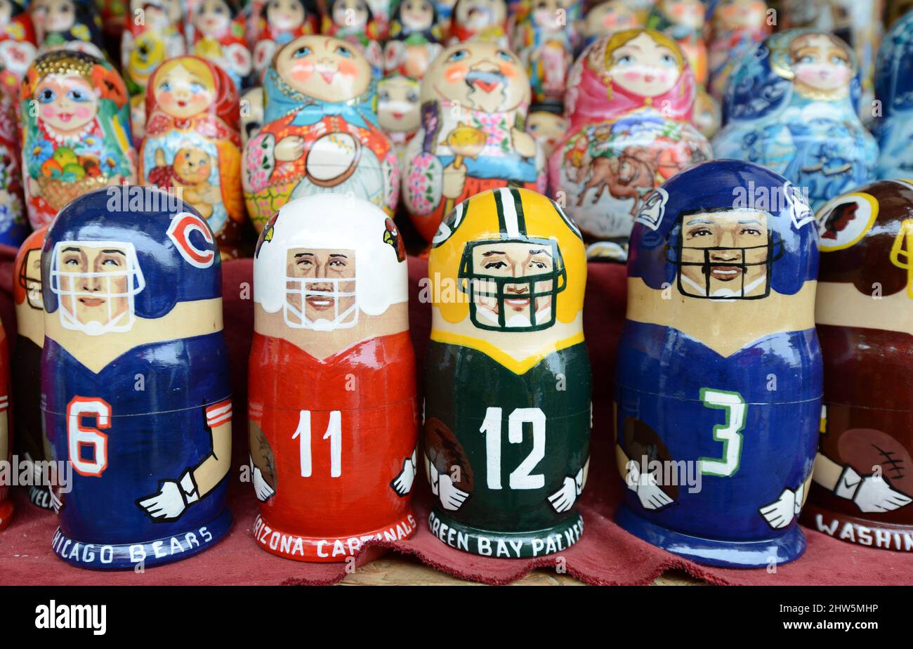 Traditional and modern Matryoshka dolls displayed by an artist in his stall on Andriivs'kyi descent in Kyiv, Ukraine. Stock Photo