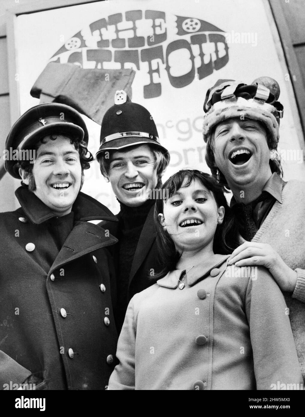 Members of theLiverpool pop group The Scaffold left to right: John Gorman, Mike McCartney (Mike MCGear) and Roger McGough with female fan. April 1967. Stock Photo