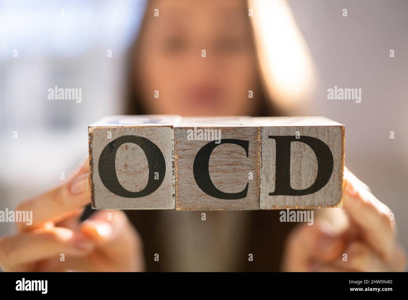 OCD Perfectionist Obsession. Perfectionist With Wooden Blocks Stock Photo