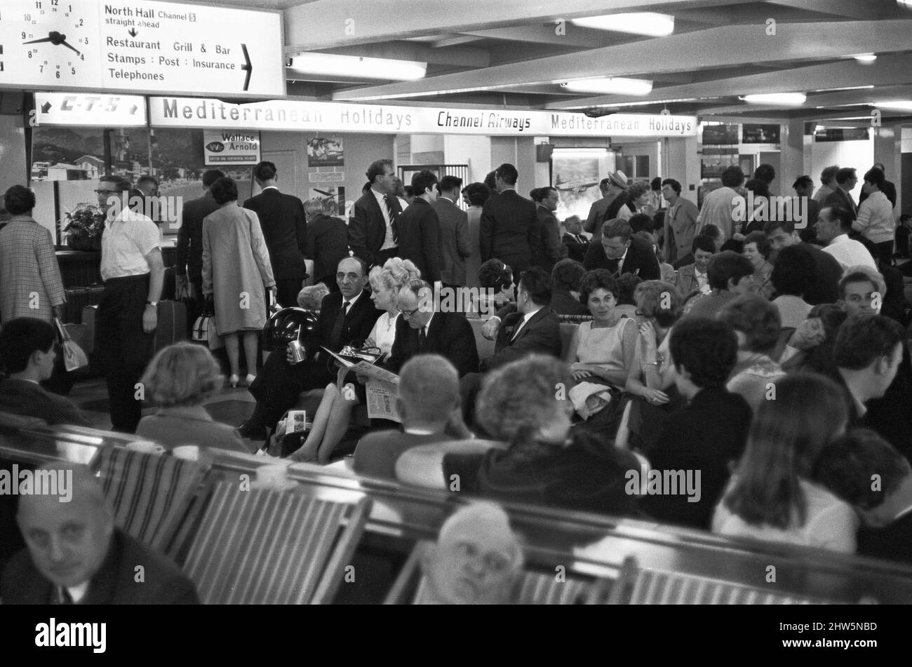 Holidaymakers waiting for their flight to be called at Southend Airport 13th July 1968 Stock Photo