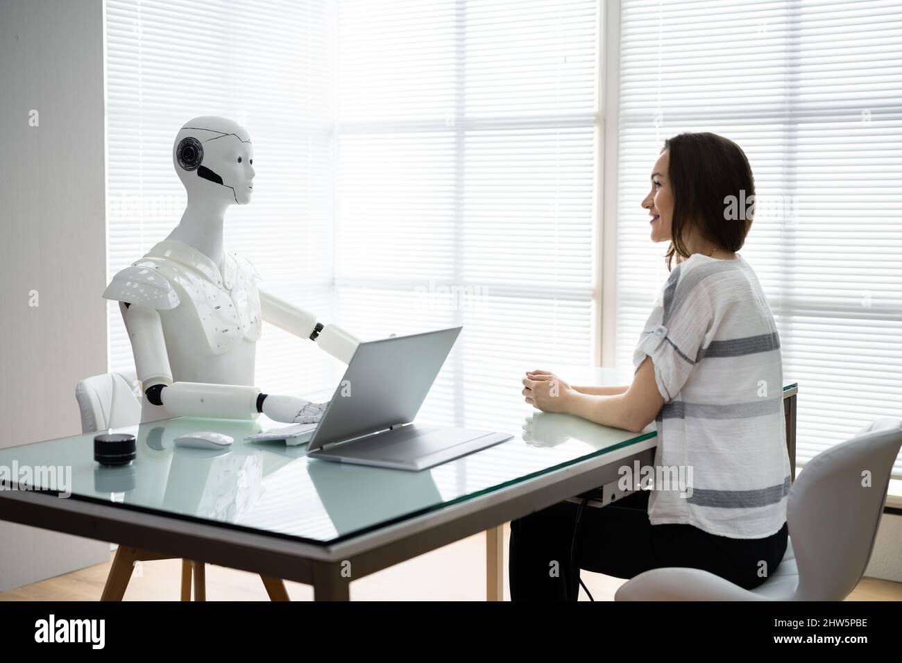 Female Patient Treatment By Robot Doctor In Hospital Stock Photo